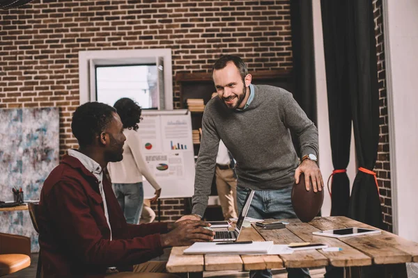 Casual businesspeople working together on project in loft office — Stock Photo