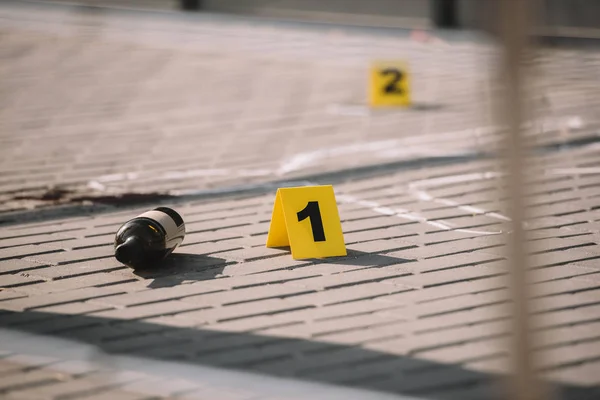 Close up view of crime scene with chalk line and numbers — Stock Photo