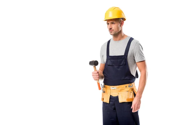 Construction worker in tool belt holding hammer isolated on white — Stock Photo