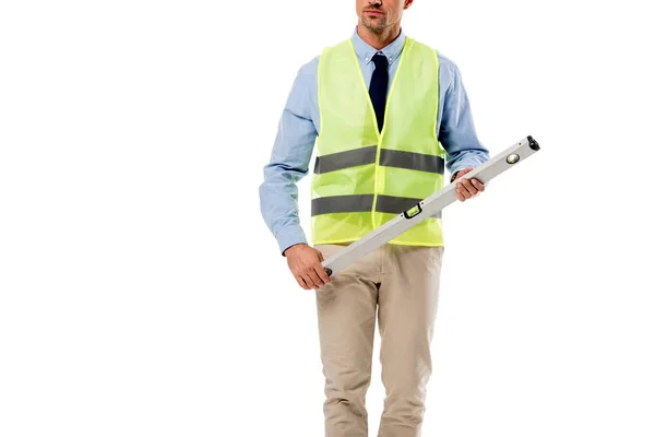 Cropped view engineer in helmet holding spirit level isolated on white — Stock Photo