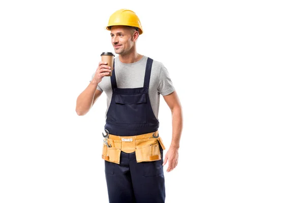 Construction worker in helmet drinking coffee to go isolated on white — Stock Photo