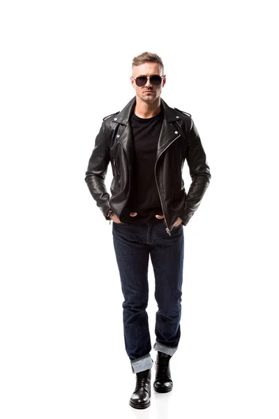 Stylish adult man in leather jacket with hands in pockets isolated on white — Stock Photo