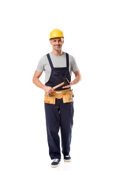 Construction worker with tool belt holding hammer isolated on white — Stock Photo