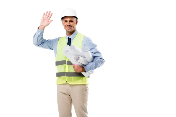 Smiling engineer holding blueprints and waving isolated on white — Stock Photo