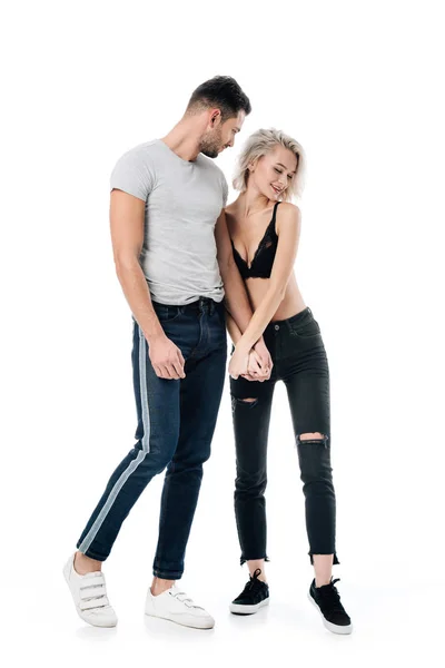 Beautiful heterosexual couple posing and holding hands isolated on white — Stock Photo