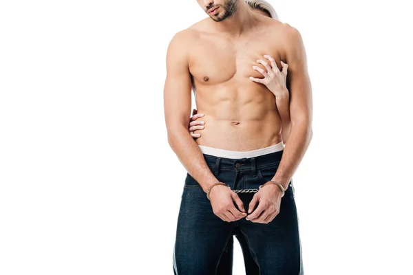 Cropped view of woman touching shirtless handcuffed man from behind isolated on white — Stock Photo