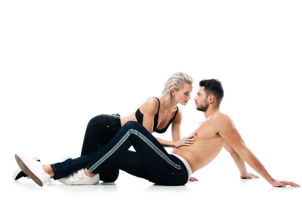 Femme sexy touchant doucement homme torse nu isolé sur blanc — Photo de stock