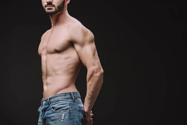 Cropped view of sexy shirtless macho posing isolated on black — Stock Photo