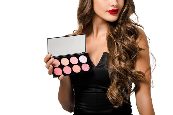 Cropped view of girl in black dress with red lips holding palette with eyeshadows isolated on white — Stock Photo