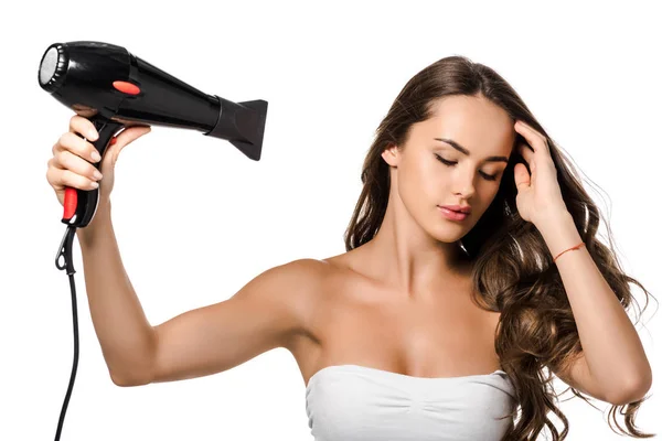 Beautiful girl using hair dryer isolated on white — Stock Photo