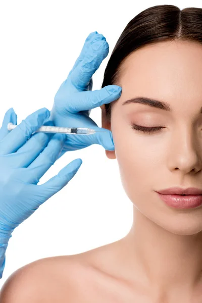 Doctor in latex gloves giving beauty injection with syringe to nude woman isolated on white — Stock Photo