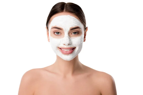 Smiling nude woman with facial skin care mask isolated on white — Stock Photo