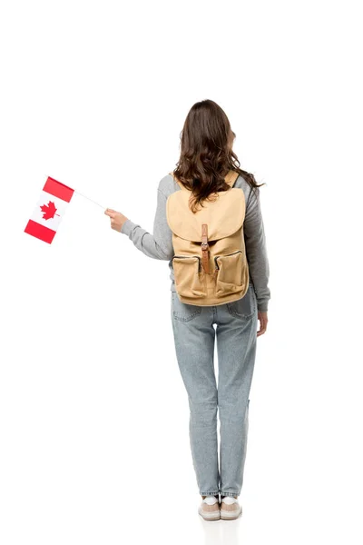 Back view of female student with canadian flag and backpack isolated on white — Stock Photo