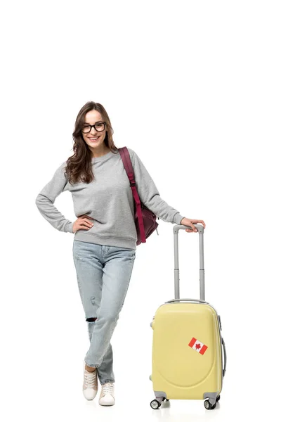 Smiling female student with suitcase isolated on white, studying abroad concept — Stock Photo