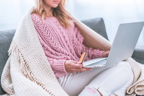 Cropped view of woman shopping online and holding credit card — Stock Photo
