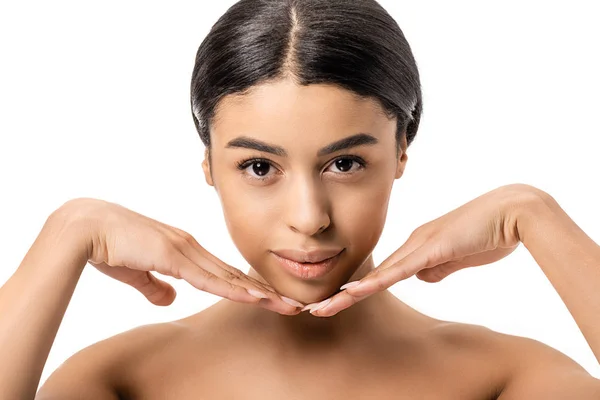 Beautiful naked african american girl touching face and looking at camera isolated on white — Stock Photo