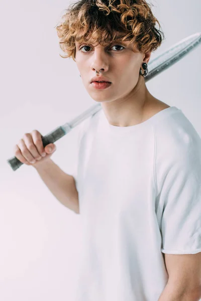 Handsome man holding tennis racket isolated on grey — Stock Photo