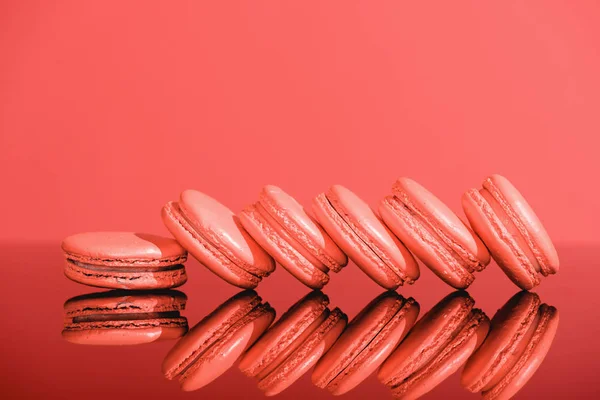 Living coral macaroons with reflection. Pantone color of the year 2019 concept — Stock Photo