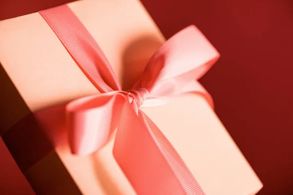 Close up of gift box in living coral color. Pantone color of the year 2019 concept — Stock Photo