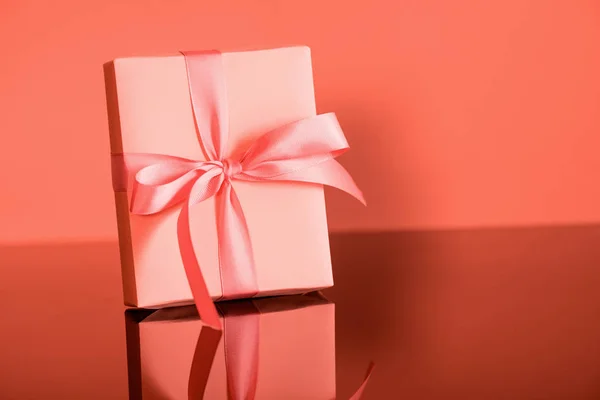 Birthday gift box in trendy living coral color. Pantone color of the year 2019 concept — Stock Photo