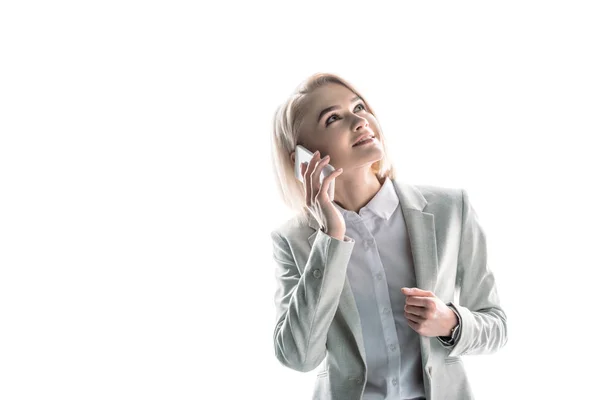 Cheerful, pretty businesswoman talking on smartphone and looking up on white — Stock Photo