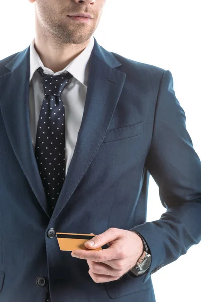 Vue partielle de l'homme d'affaires souriant avec carte de crédit isolé sur blanc — Photo de stock