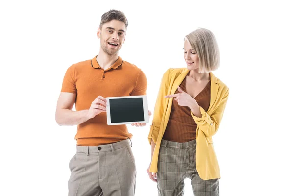 Pretty blonde woman pointing on digital tablet with blank screen in man hands isolated on white — Stock Photo