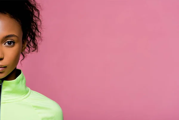 Cropped view of beautiful african american sportswoman looking at camera isolated on pink with copy space — Stock Photo