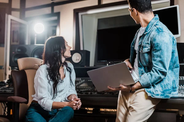 Two multicultural sound producers working in recording studio together — Stock Photo