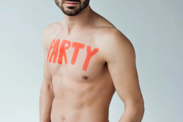 Partial view of shirtless man with inscription on body isolated on grey — Stock Photo