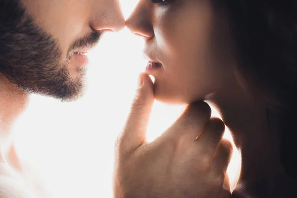 Cropped view of man gently touching girlfriend isolated on white — Stock Photo