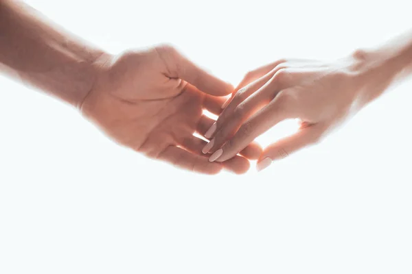 Partial view of man and woman holding hands isolated on white — Stock Photo