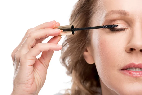Cropped view of mature woman applying mascara Isolated On White — Stock Photo