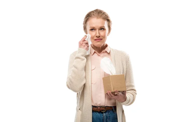 Sad middle aged woman crying and wiping face with tissue Isolated On White — Stock Photo