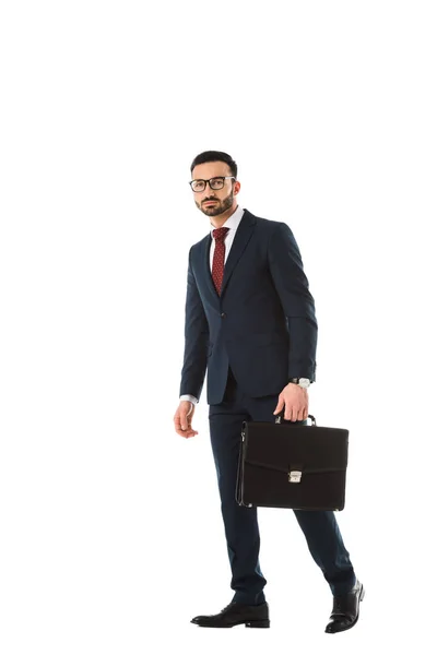 Confident businessman with briefcase looking at camera isolated on white — Stock Photo