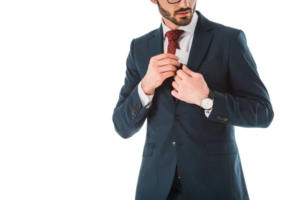 Vista cortada de empresário em terno preto recebendo cartão de visita fora da jaqueta isolada no branco — Fotografia de Stock