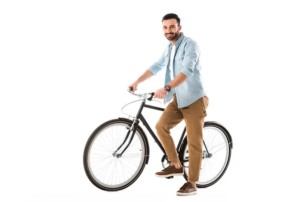 Красивий веселий чоловік з велосипедом посміхається на камеру ізольовано на білому — стокове фото