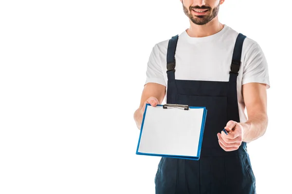 Partial view of delivery man holding clipboard with blank paper isolated on white — Stock Photo