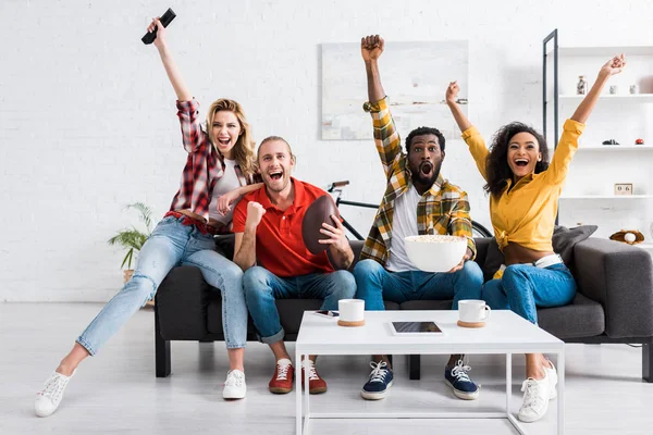 Happy multicultural friends watching sport match and having fun together — Stock Photo