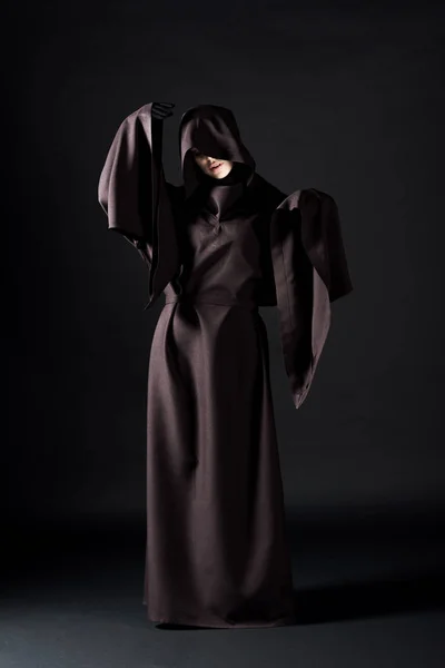 Full length view of woman in death costume on black — Stock Photo