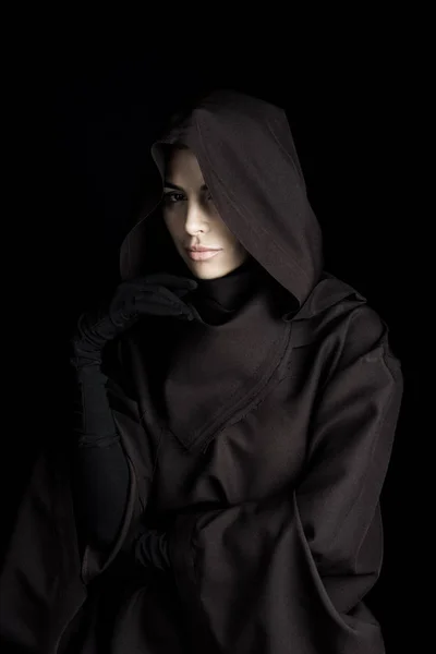 Pensive woman in death costume looking at camera isolated on black — Stock Photo