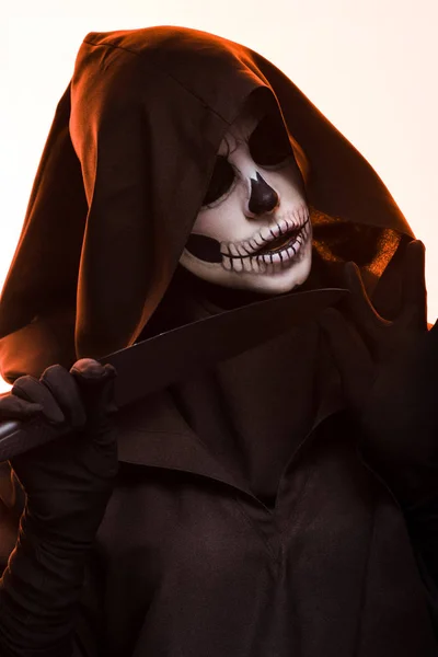 Woman with skull makeup holding knife isolated on white — Stock Photo