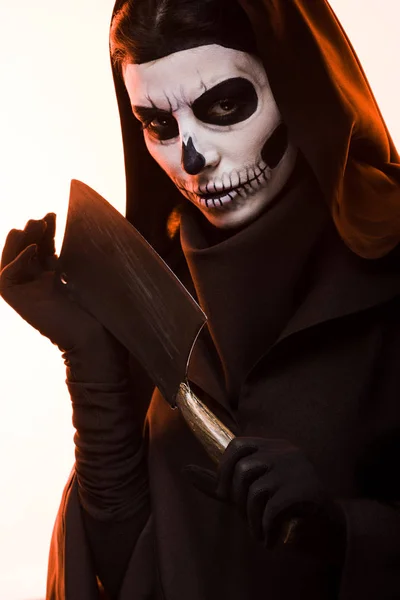 Woman in death costume holding cleaver isolated on white — Stock Photo