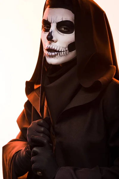 Woman in death costume holding cleaver isolated on white — Stock Photo
