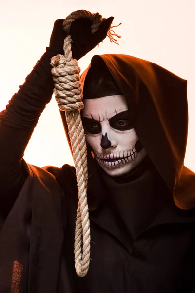 Woman in death costume holding hanging noose isolated on white — Stock Photo