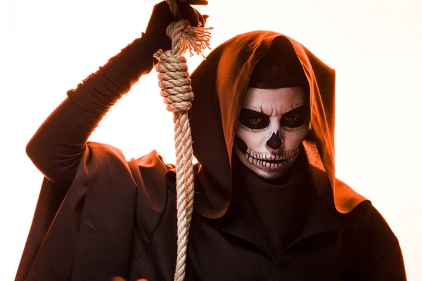 Woman in death costume holding hanging noose isolated on white — Stock Photo