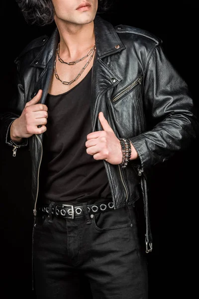 Cropped view of man touching leather jacket isolated on black — Stock Photo