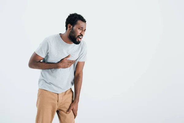 Handsome african american man having heart attack isolated on grey — Stock Photo