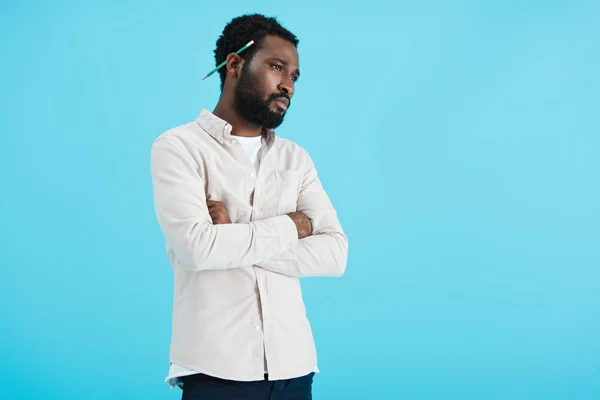 Pensive african american man with pencil isolated on blue — Stock Photo