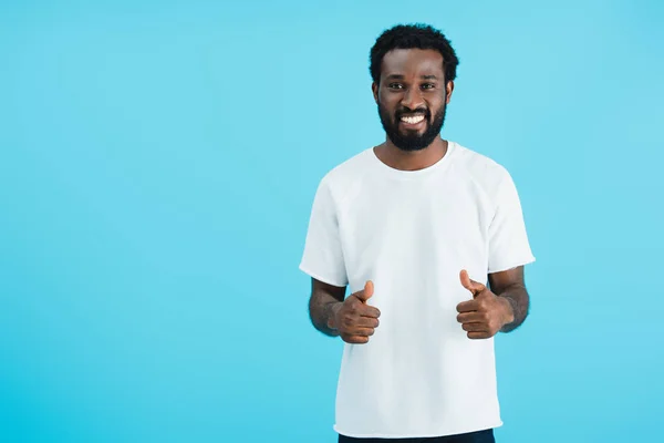 Happy african american man showing thumbs up isolated on blue — Stock Photo